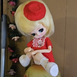 Adorable Red and White Doll with Blonde Hair